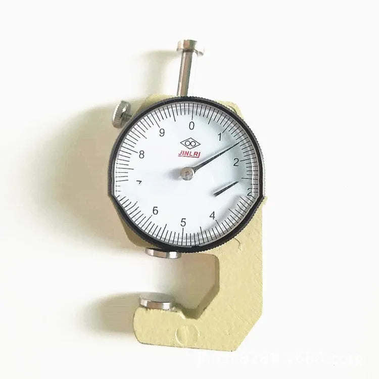 A film thickness gauge for measuring steel tubing, with scales showing 0-10mm and 0-20mm ranges.