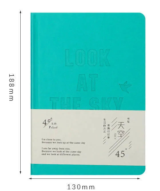 A5 hardcover notebook with butterfly-themed art cover and open colour pages.