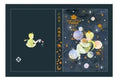 Hardback notebook with The Little Prince design cover, open to show saddle stitch binding and blank pages.