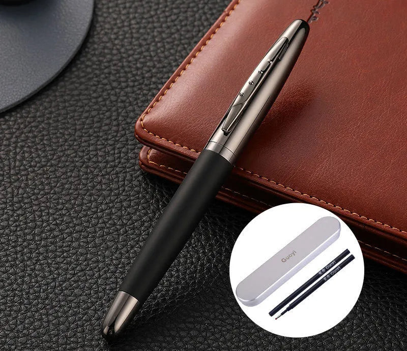 Heavy hand metal jewel signature pen with anti-slip grip on a desk, with blue refill visible