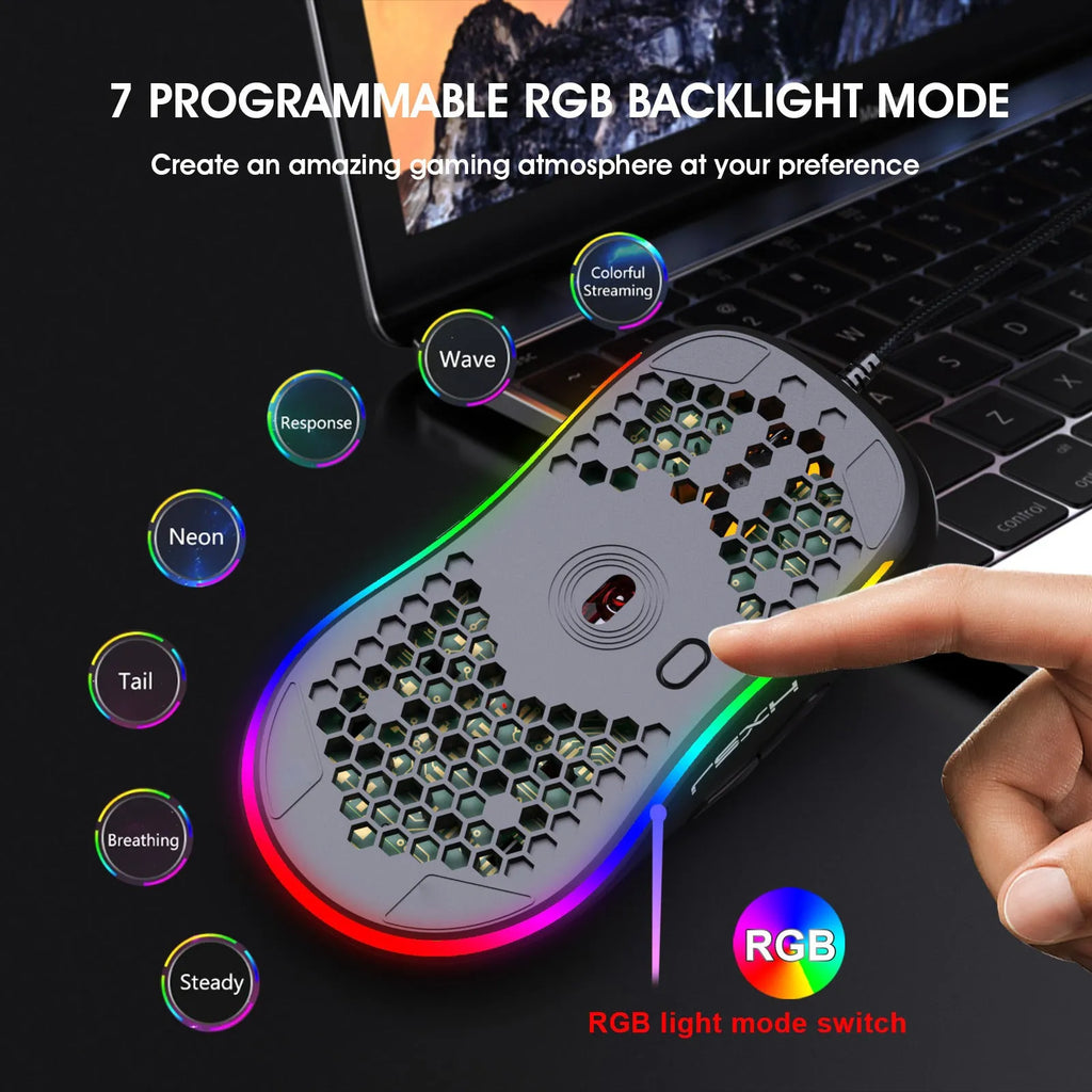 Black wired optical gaming mouse with honeycomb shell and RGB glow on a desk