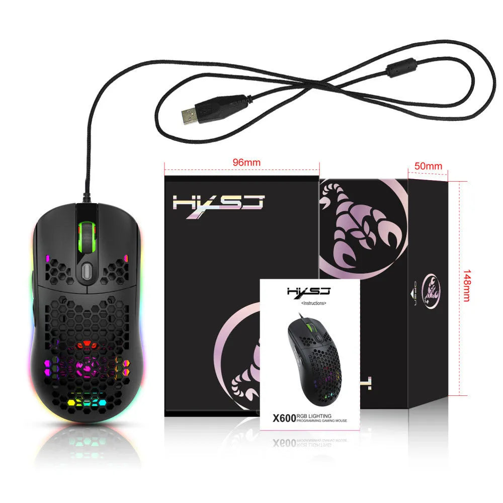 Black wired optical gaming mouse with honeycomb shell and RGB glow on a desk