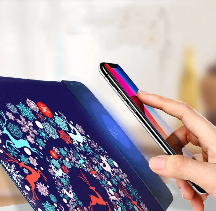 Cartoon wireless charging mouse pad with RGB lighting on a desk