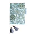 Flying blue flowers pattern fabric cover notebook in A5 and A6 sizes on a desk.