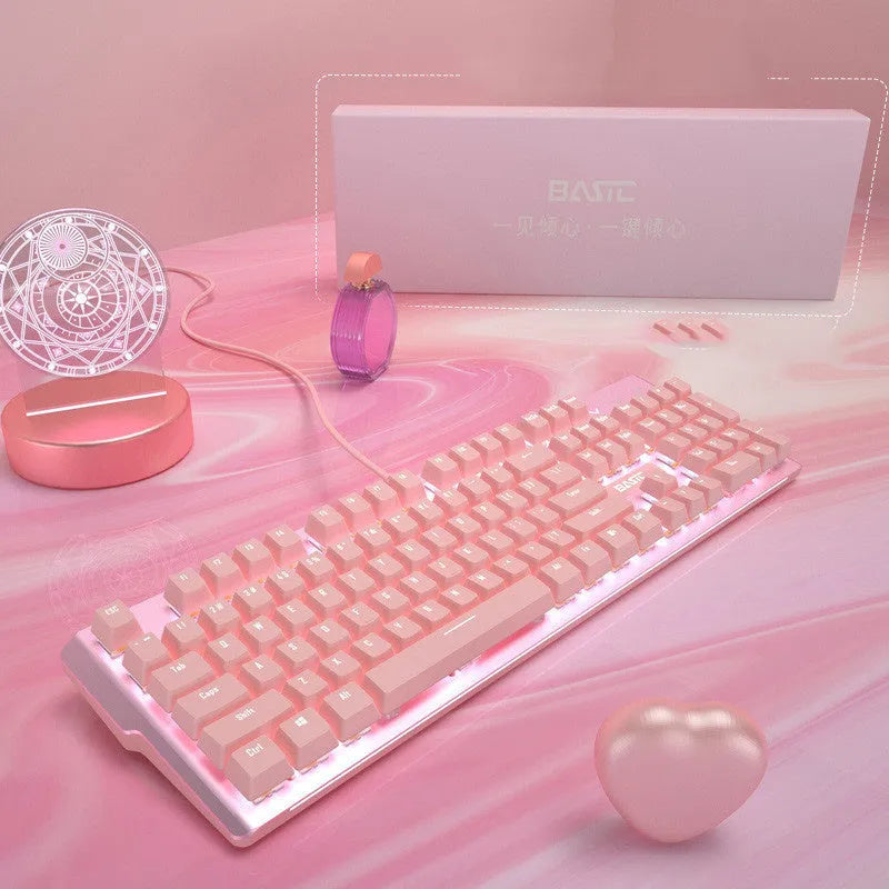 Pink mechanical gaming keyboard and wired mouse set on a desk.