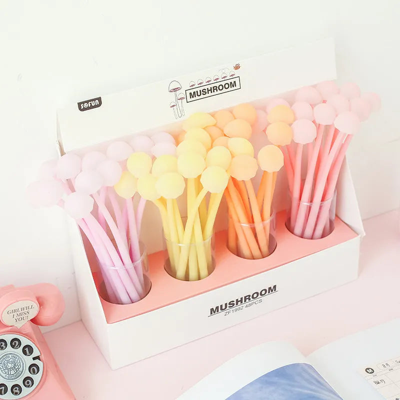 Luminous mushroom silicone gel pen in black with soft grip body and cartoon design on white background