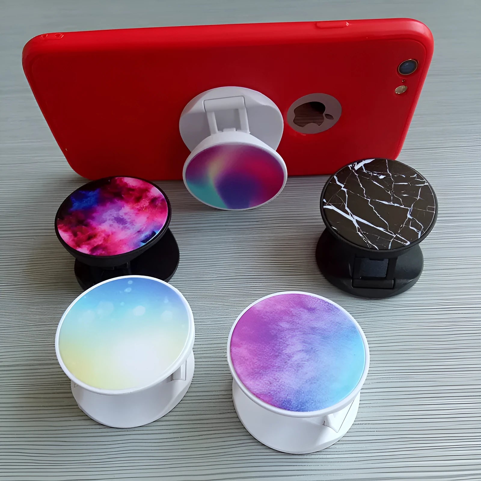 Folding mobile phone holder with thermal transfer aluminium sheet decoration on desktop