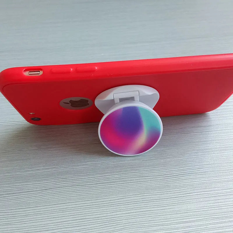Folding mobile phone holder with thermal transfer aluminium sheet decoration on desktop