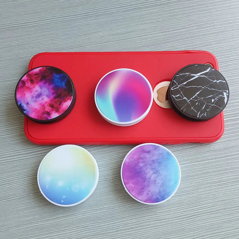 Folding mobile phone holder with thermal transfer aluminium sheet decoration on desktop