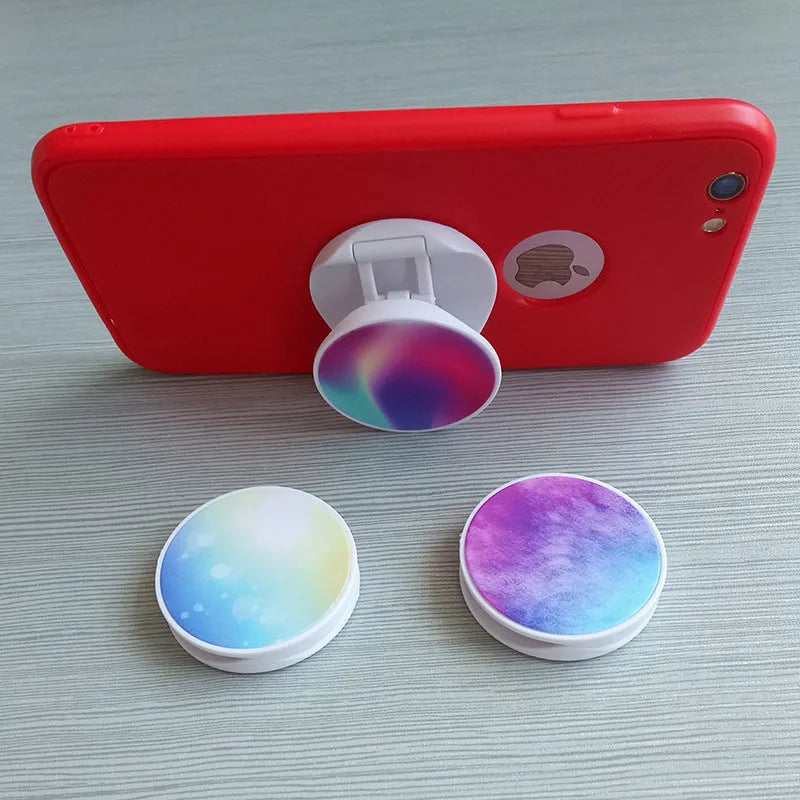 Folding mobile phone holder with thermal transfer aluminium sheet decoration on desktop