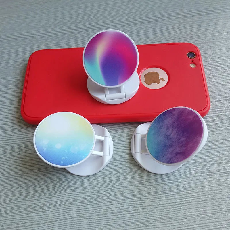 Folding mobile phone holder with thermal transfer aluminium sheet decoration on desktop