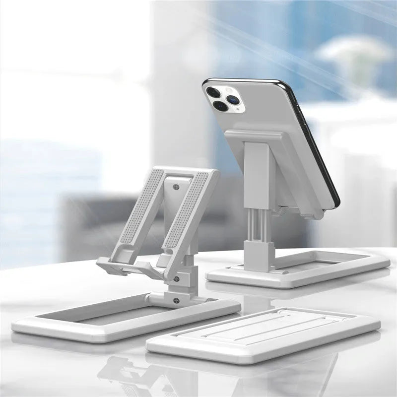 A retractable, foldable mobile phone desktop stand in an extended position, holding a smartphone.
