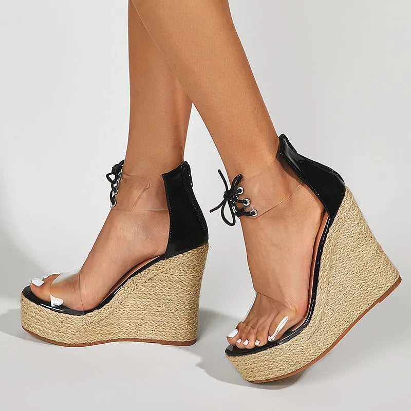 Black women's wedge sandals with hemp rope detail on the upper and a super high platform heel.