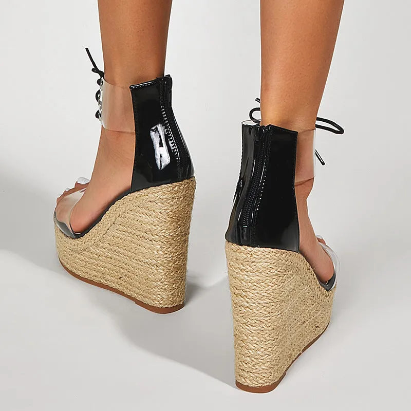 Black women's wedge sandals with hemp rope detail on the upper and a super high platform heel.