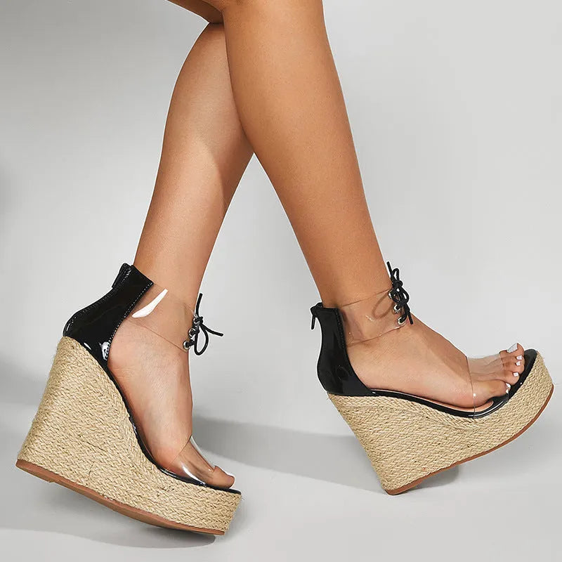 Black women's wedge sandals with hemp rope detail on the upper and a super high platform heel.