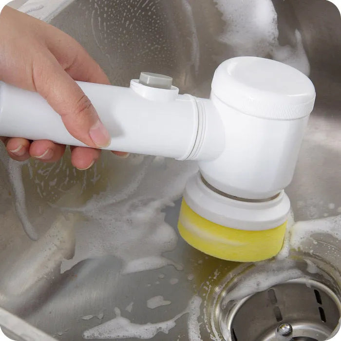White electric cleaning brush with three interchangeable heads for household surfaces