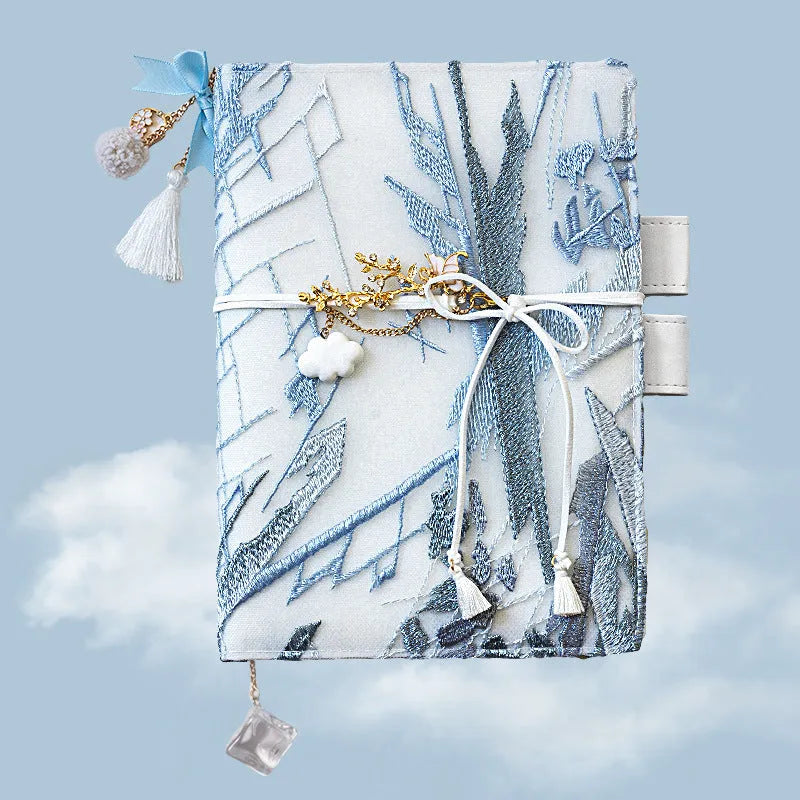 Glacier embroidery fabric notebook in A6 and A5 sizes with grid pages.