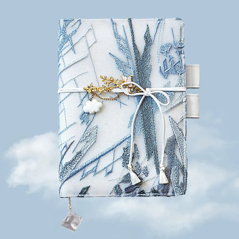 Glacier embroidery fabric notebook in A6 and A5 sizes with grid pages.