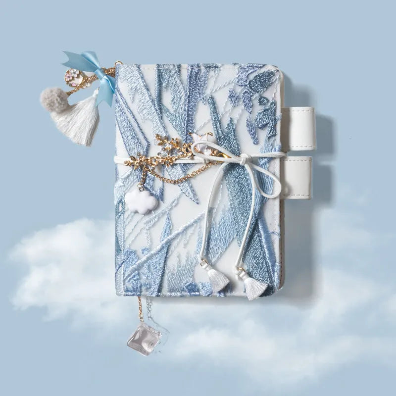 Glacier embroidery fabric notebook in A6 and A5 sizes with grid pages.