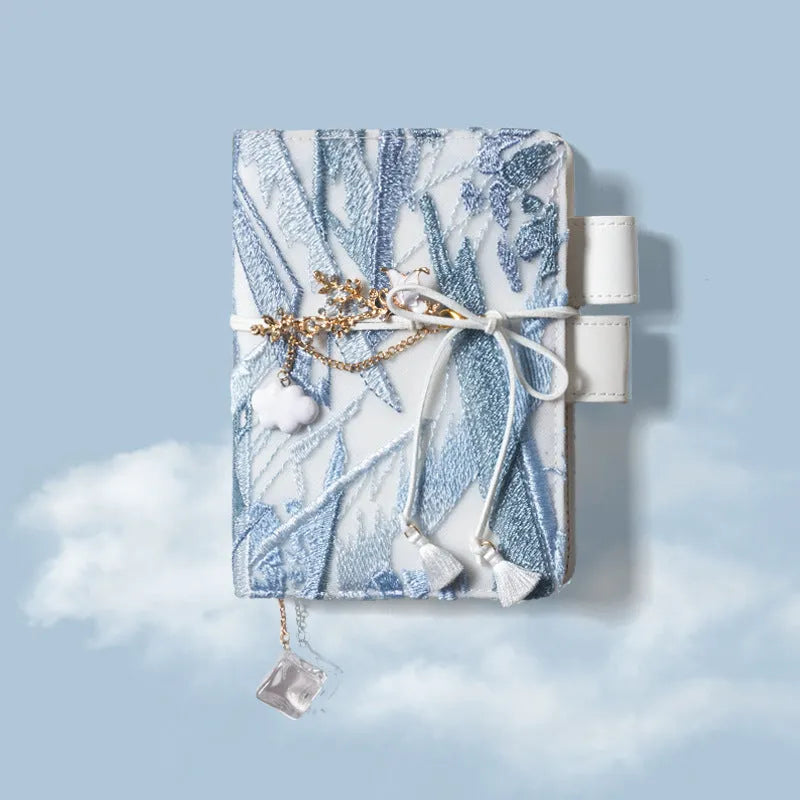 Glacier embroidery fabric notebook in A6 and A5 sizes with grid pages.