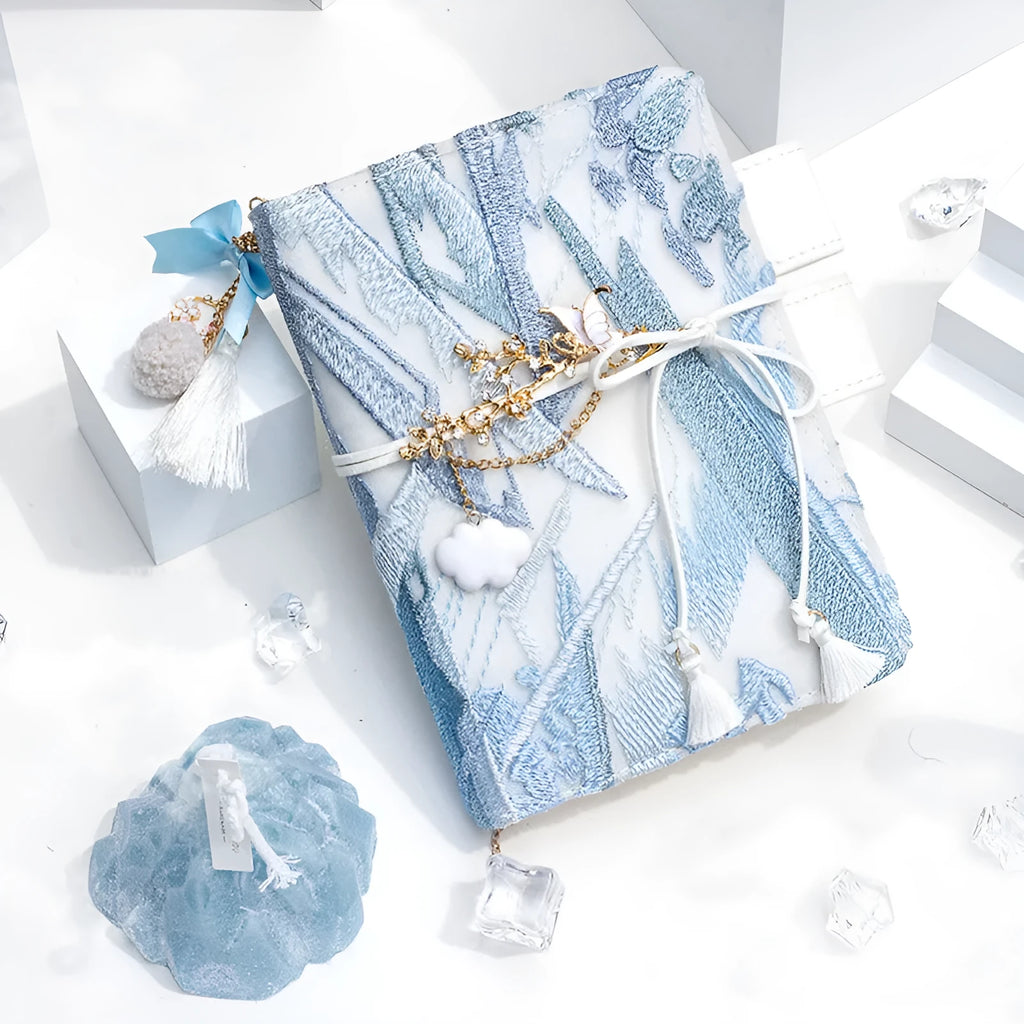 Glacier embroidery fabric notebook in A6 and A5 sizes with grid pages.