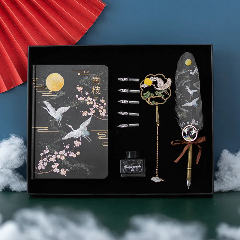 Chinese style metal shell feather pen set with four packs of coloured feathers and a notebook.