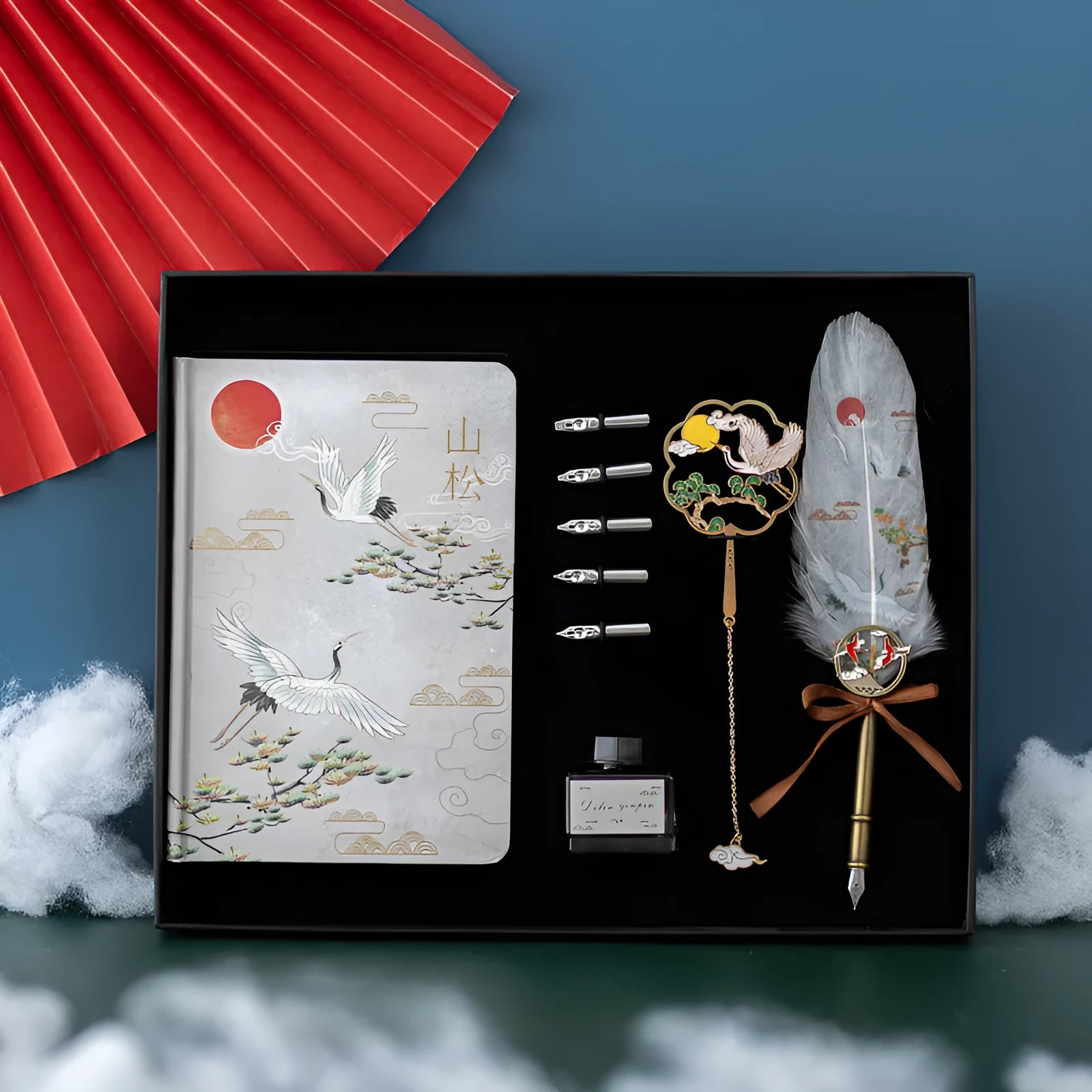 Chinese style metal shell feather pen set with four packs of coloured feathers and a notebook.