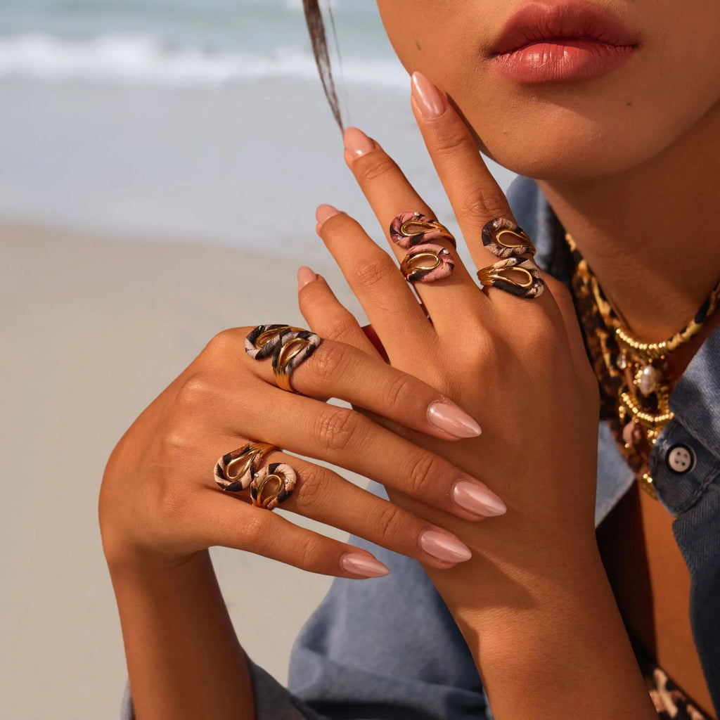 Stainless steel open mouth ring with leopard print design in geometric heart star shapes