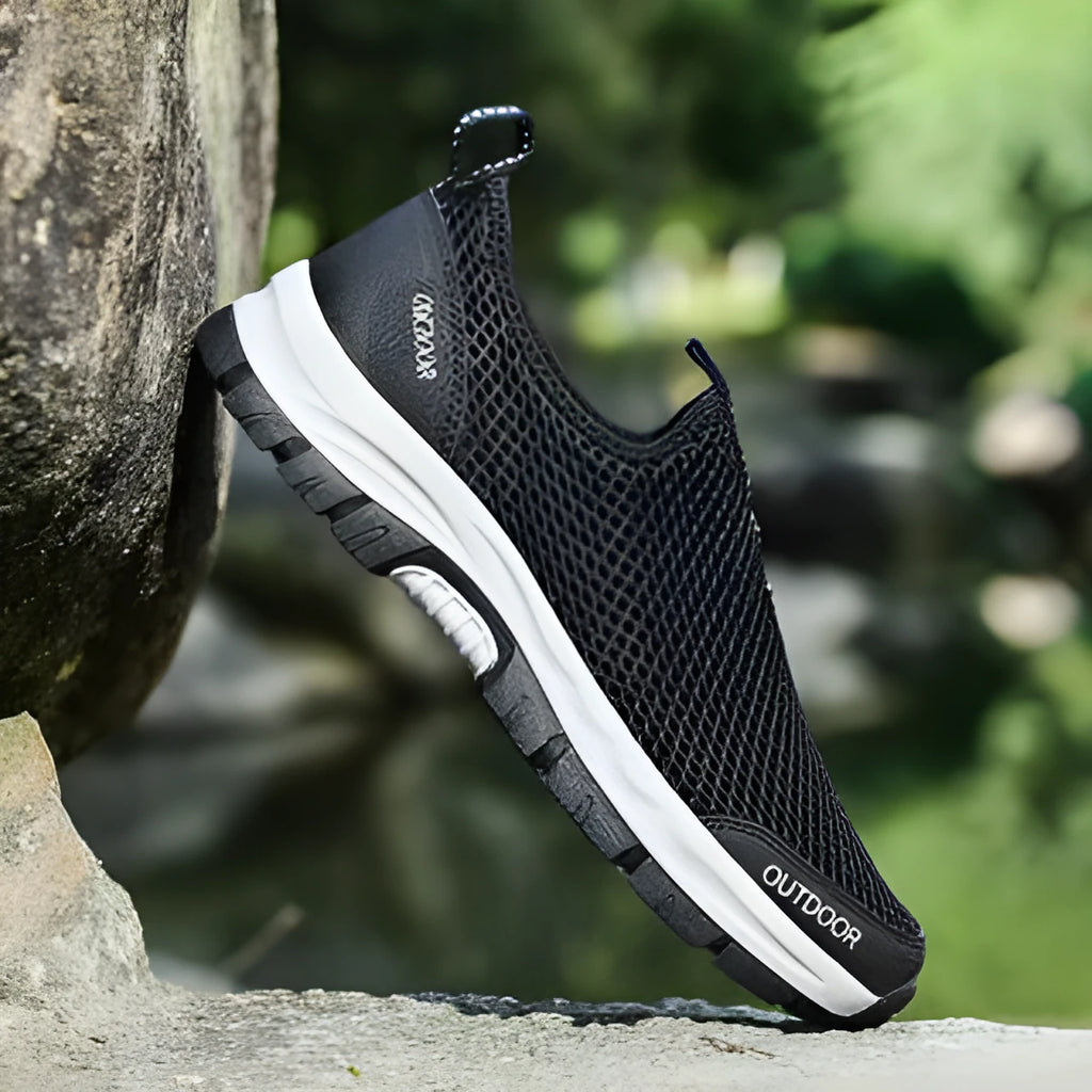 Breathable hollow mesh slip-on lazy shoes for men in black solid colour low-top design
