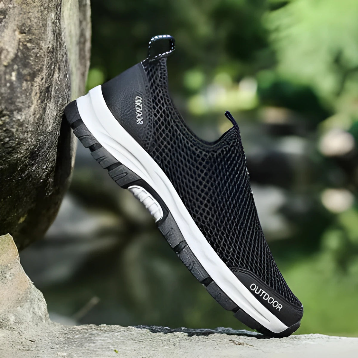 Breathable hollow mesh slip-on lazy shoes for men in black solid colour low-top design