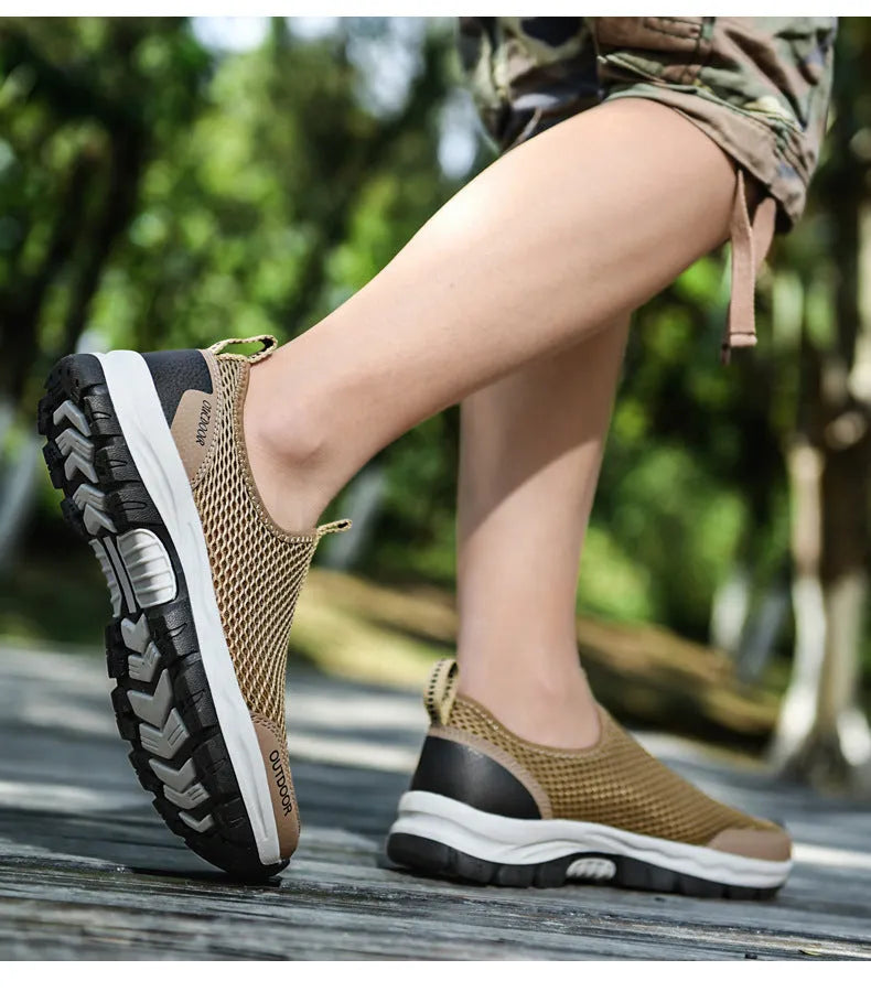 Breathable hollow mesh slip-on lazy shoes for men in black solid colour low-top design