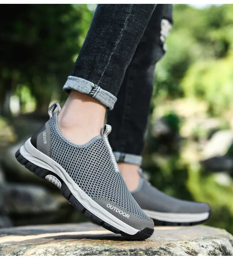 Breathable hollow mesh slip-on lazy shoes for men in black solid colour low-top design
