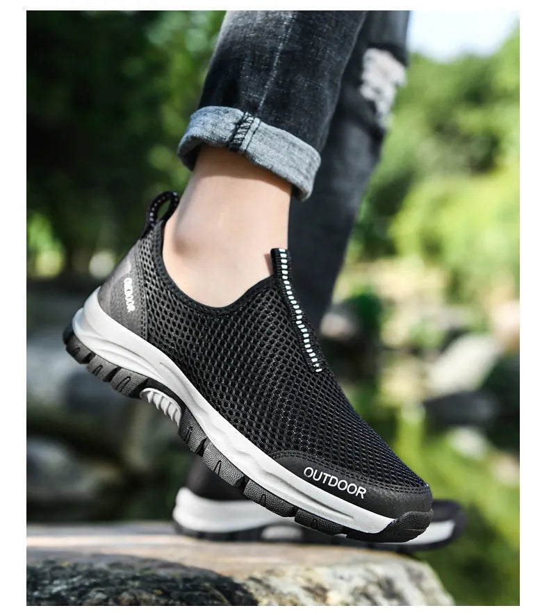 Breathable hollow mesh slip-on lazy shoes for men in black solid colour low-top design