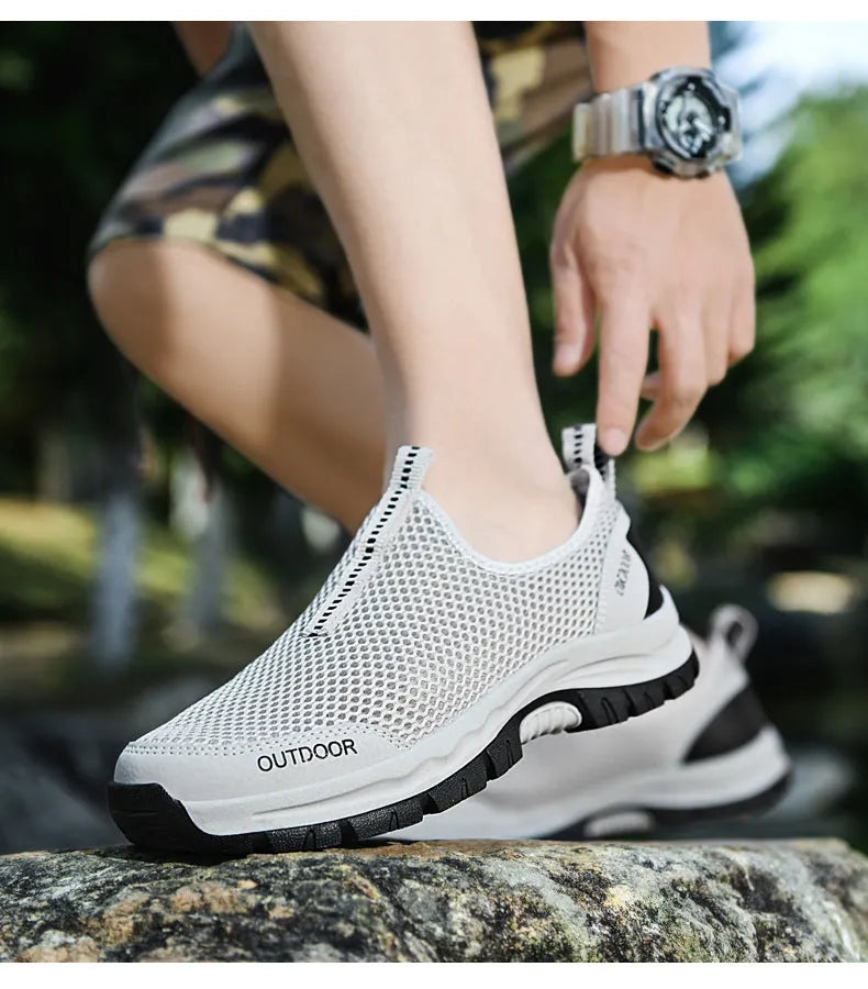 Breathable hollow mesh slip-on lazy shoes for men in black solid colour low-top design