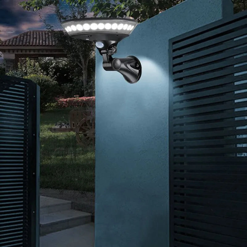White ABS solar-powered outdoor light with 360-degree luminous design and motion sensor.