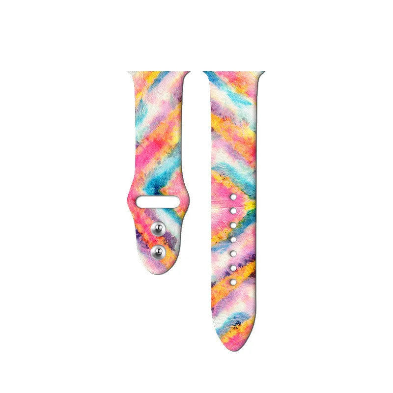 Colourful tie-dye silicone Apple Watch band with connector, shown alongside long and standard length options.