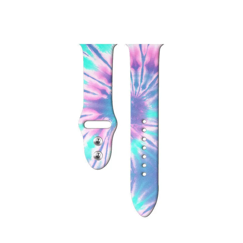 Colourful tie-dye silicone Apple Watch band with connector, shown alongside long and standard length options.