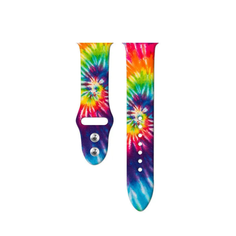 Colourful tie-dye silicone Apple Watch band with connector, shown alongside long and standard length options.