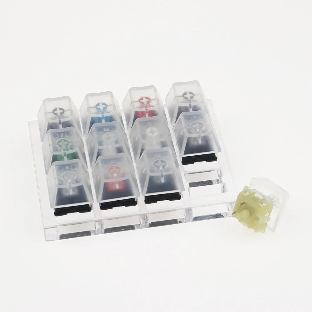 Cherry MX twelve-axis mechanical keyboard switch tester with Black Green Black Tea Milk Green switches in white housing