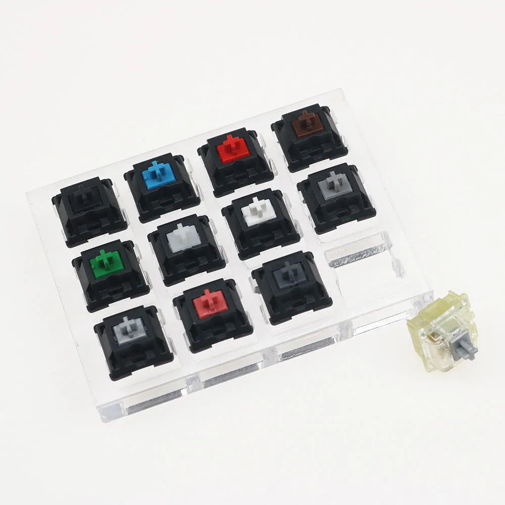 Cherry MX twelve-axis mechanical keyboard switch tester with Black Green Black Tea Milk Green switches in white housing