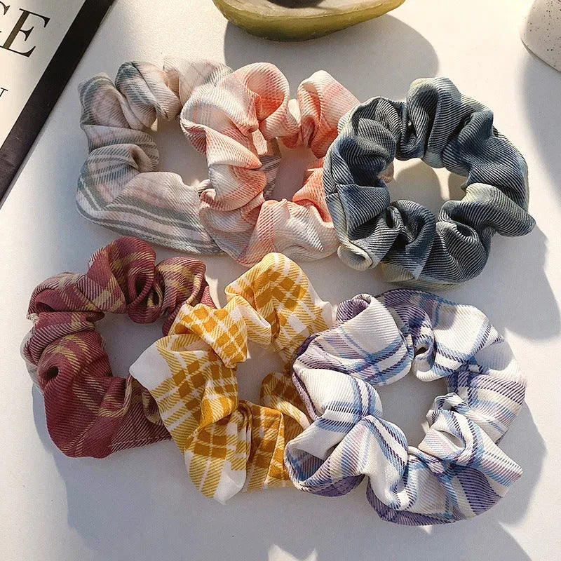 Assortment of children's hair rings and head ropes in Autumn colours including macaron designs.