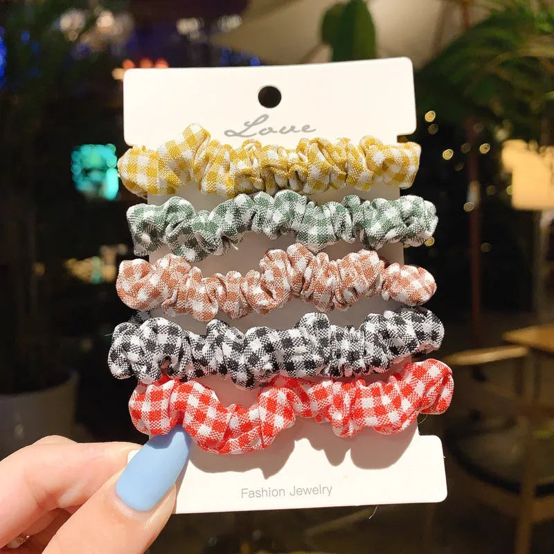 Assortment of children's hair rings and head ropes in Autumn colours including macaron designs.