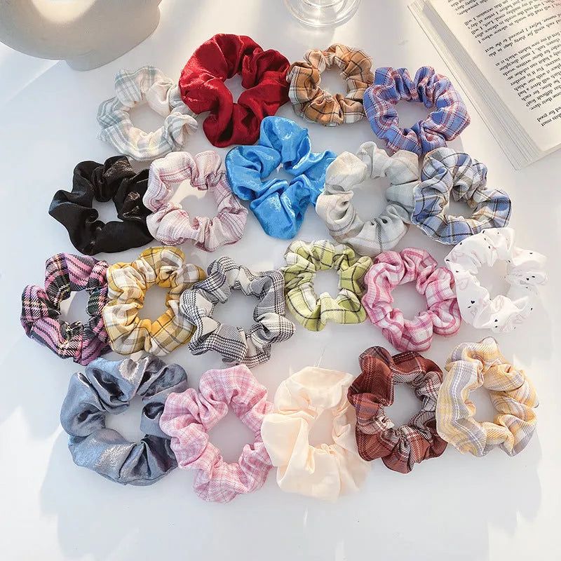 Assortment of children's hair rings and head ropes in Autumn colours including macaron designs.