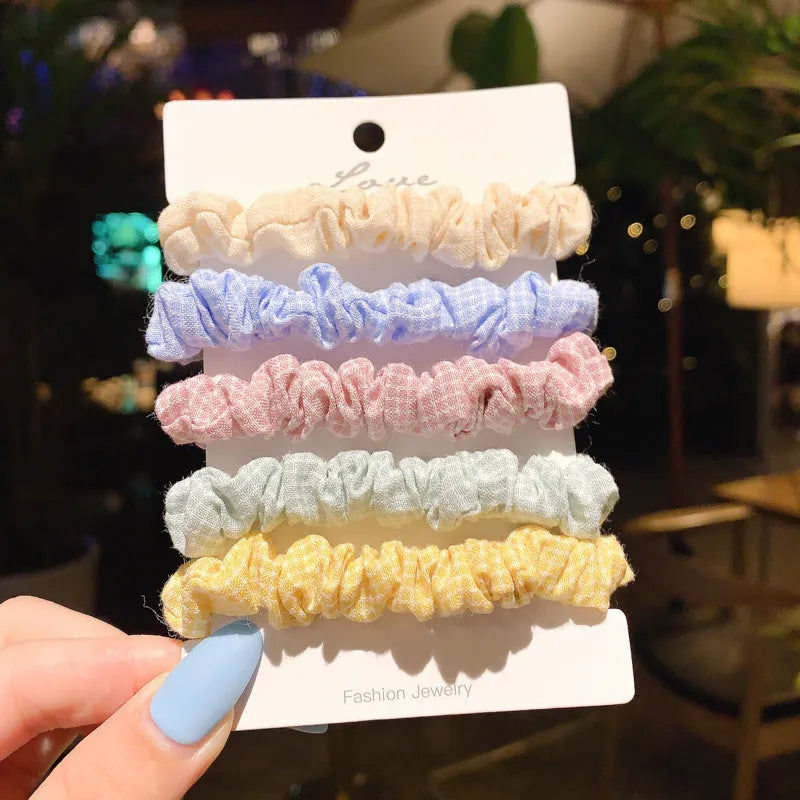 Assortment of children's hair rings and head ropes in Autumn colours including macaron designs.