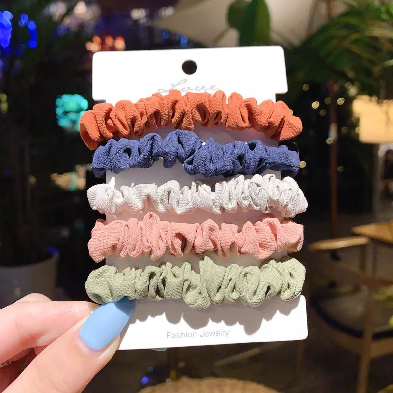Assortment of children's hair rings and head ropes in Autumn colours including macaron designs.