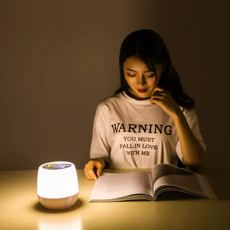 Pruixin LED projector night light projecting star and heart patterns on a bedroom wall.