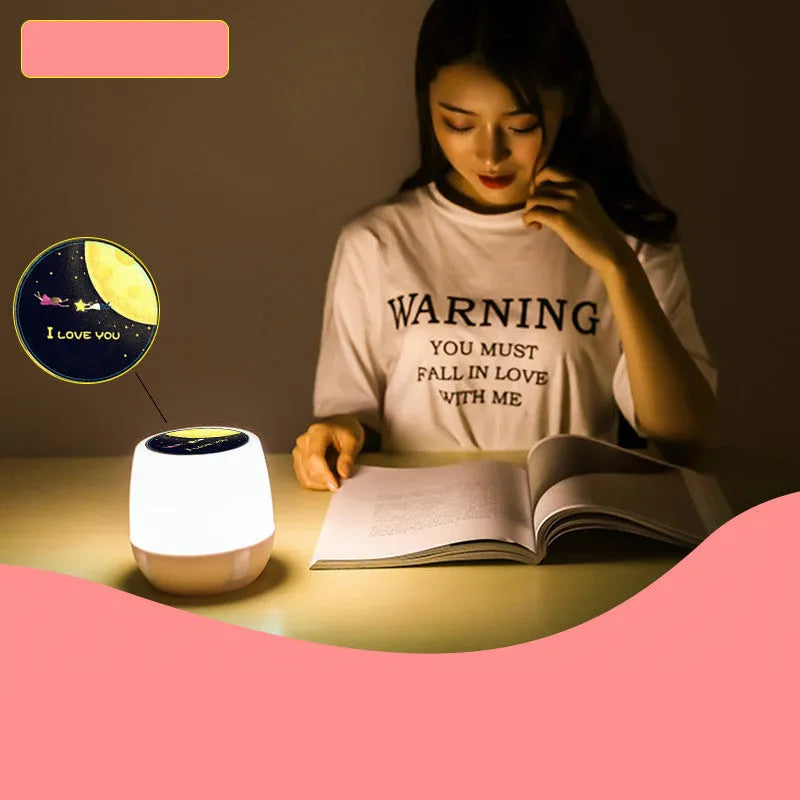 Pruixin LED projector night light projecting star and heart patterns on a bedroom wall.