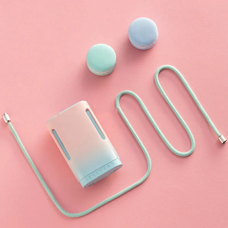 Jelly design mini USB fan shown in mint peach colour, featuring a compact body and a detachable neck strap.