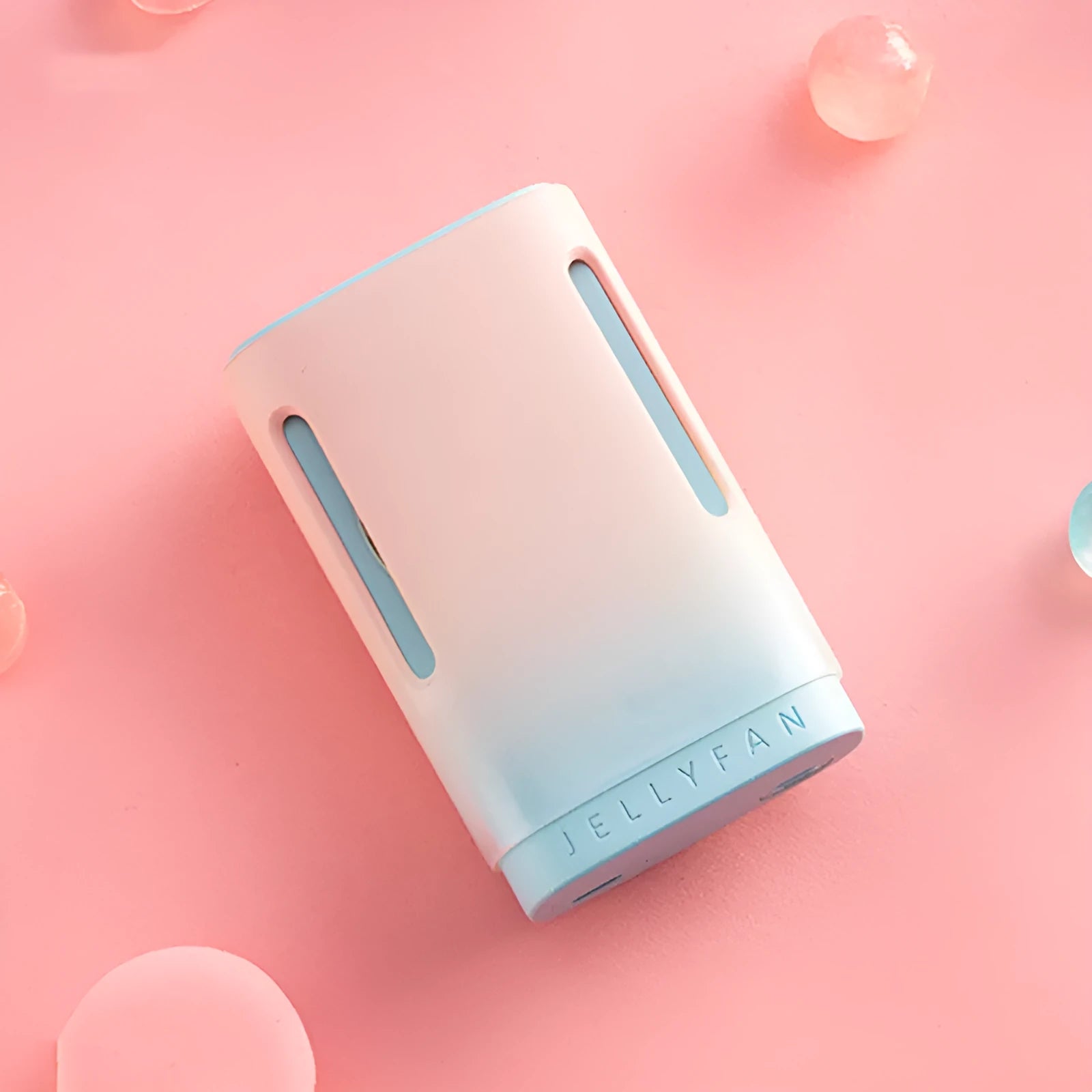 Jelly design mini USB fan shown in mint peach colour, featuring a compact body and a detachable neck strap.