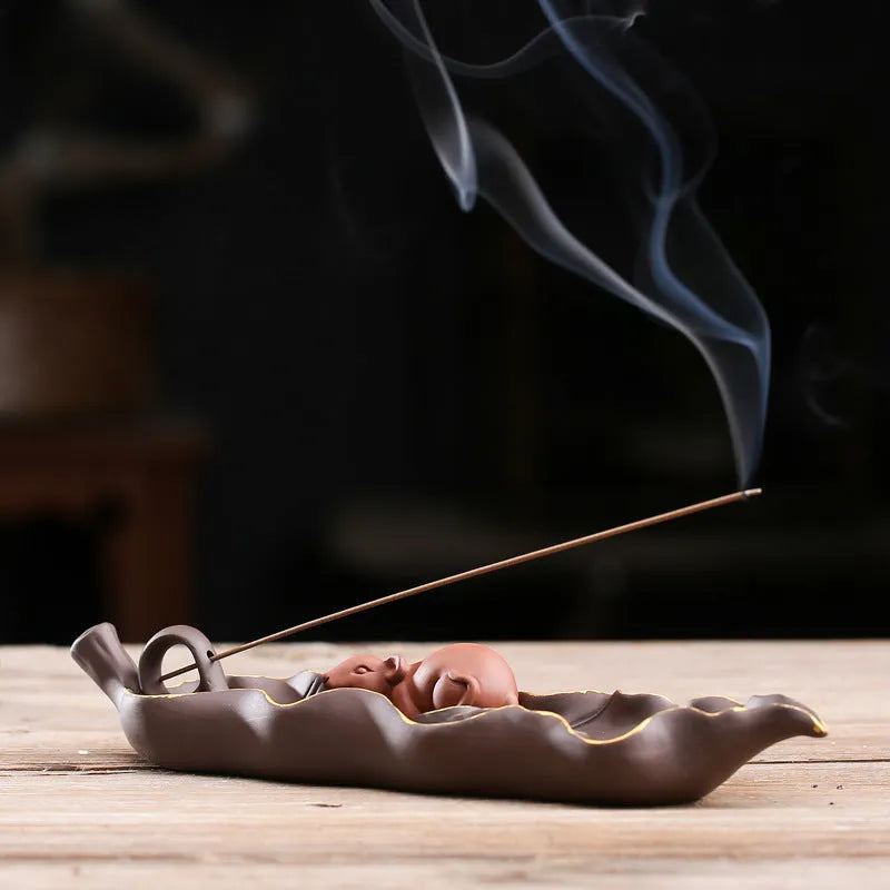 Purple clay ceramic lying incense burner with golden rat design for incense sticks